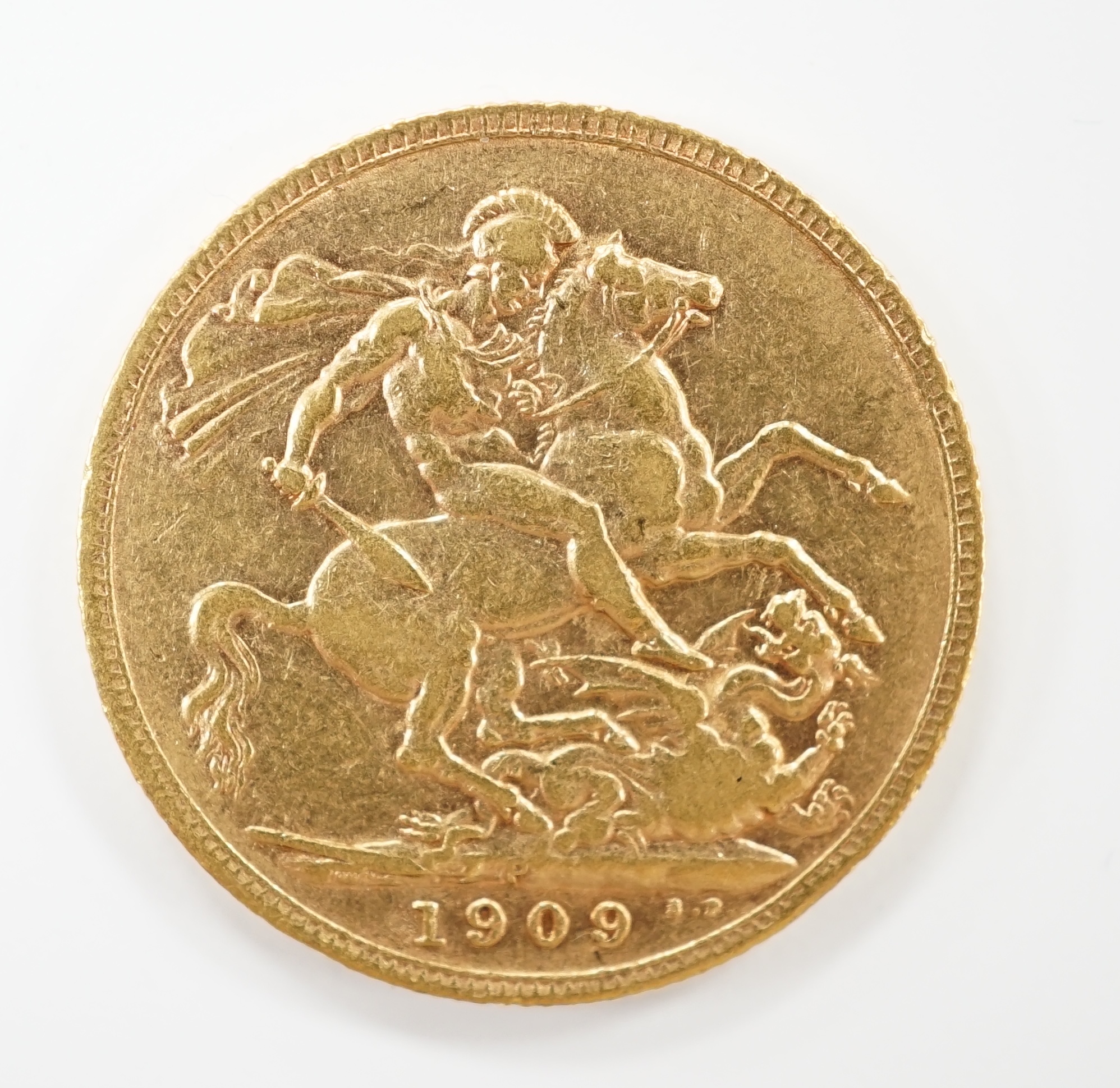 An Edward VII 1909 gold sovereign.